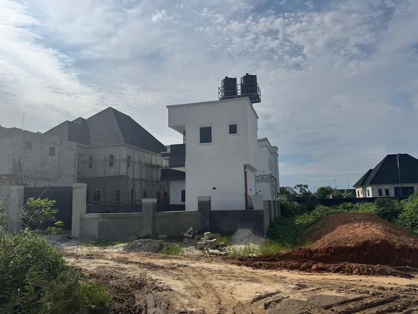 Completed duplex with overhead water tank at Joe's Villa